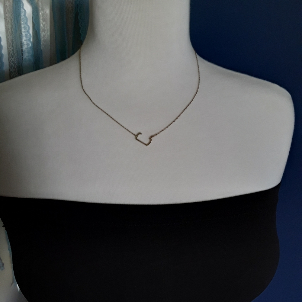 Letter C gold tone necklace